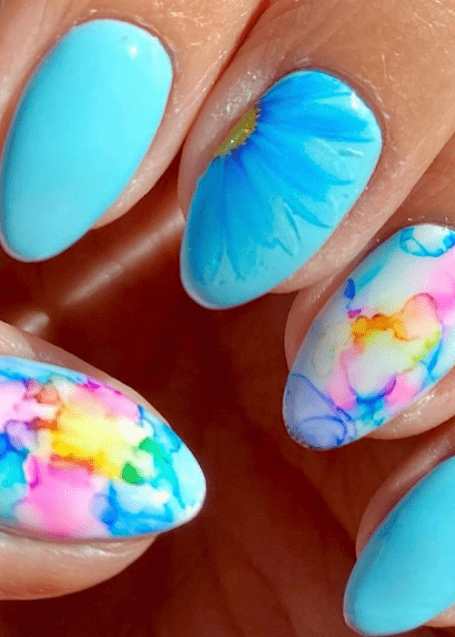 A big blue flower nail design and watercolors