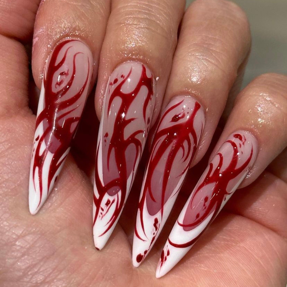 Long nails with a classic French tip and a blood spattered design on top