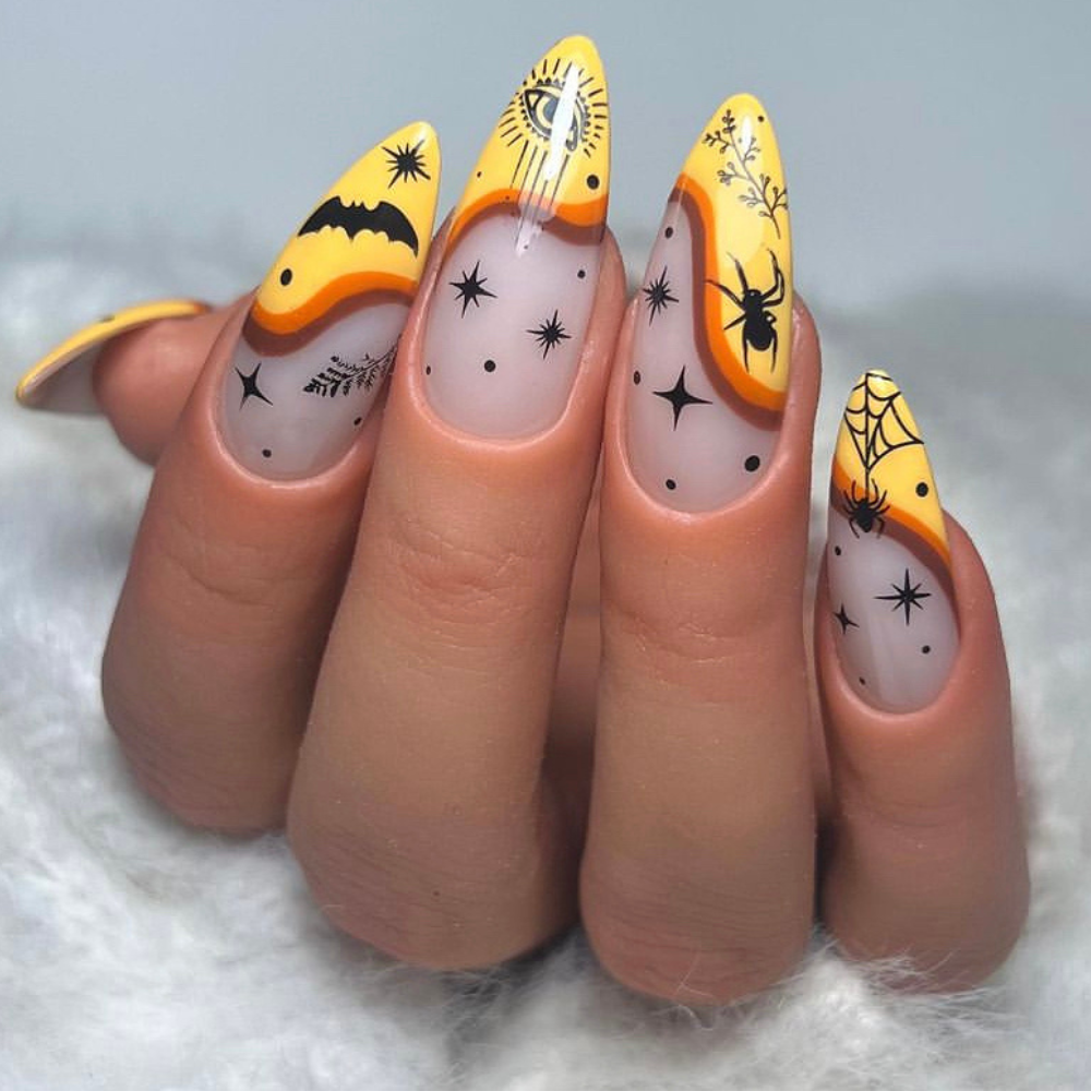 Halloween nail designs: Almond nails with a orange and yellow wave and black halloween design