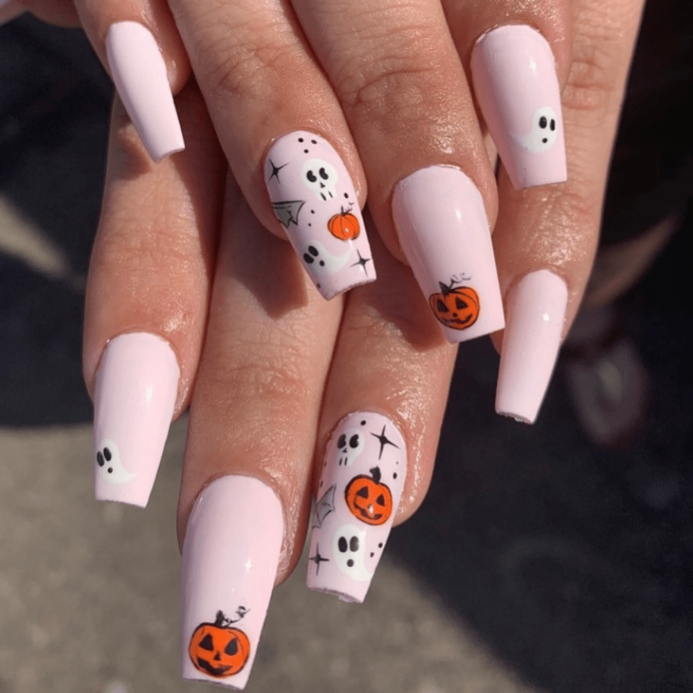 pink halloween nail desgin with pumpkins