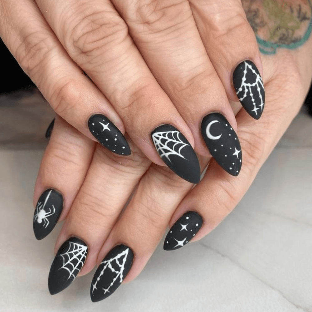 Black Halloween nail designs with spider webs