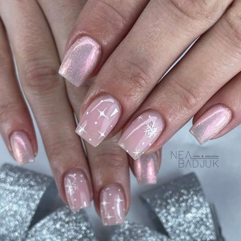 Short shimmery nails with snowflakes