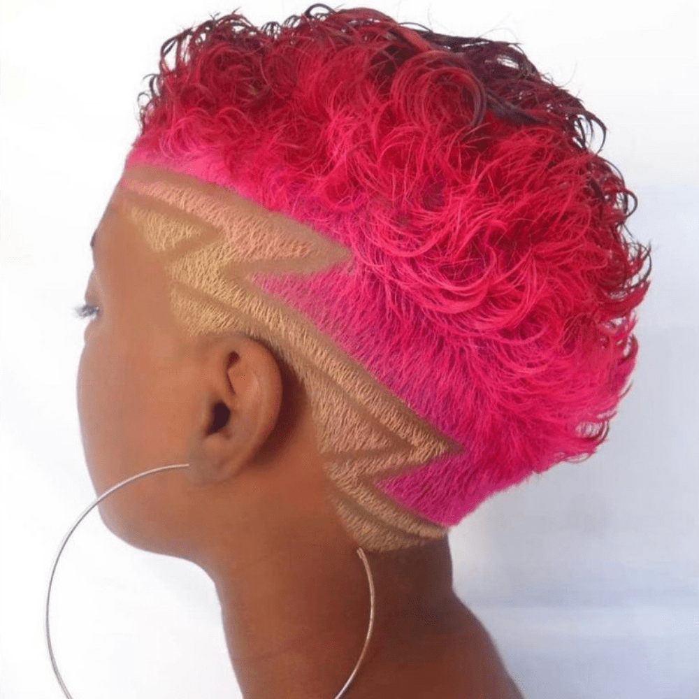 Curly pink mohawk with a zig zag design