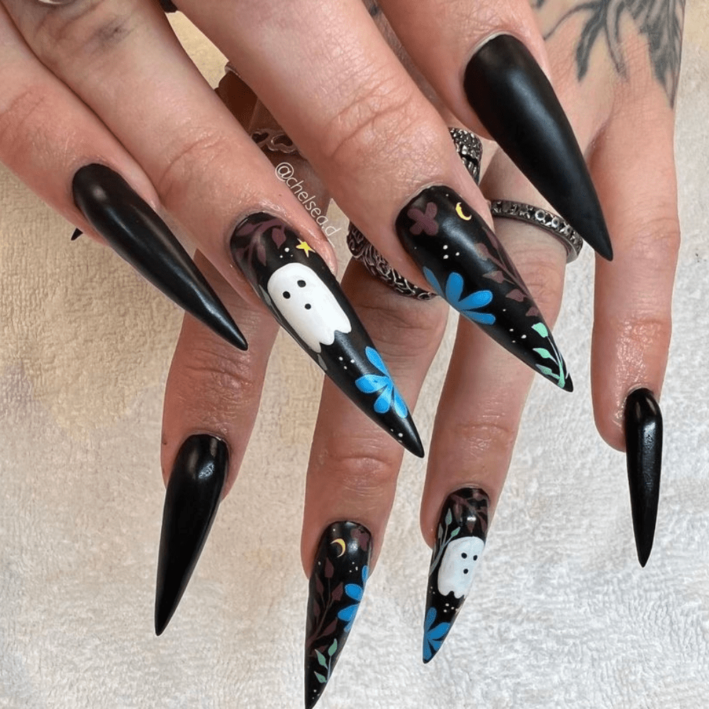 A nail design with ghosts, plants, and flowers